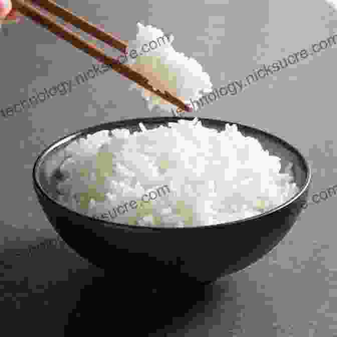 A Bowl Of Fluffy White Rice, Steaming Hot And Ready To Eat. The Chopsticks Are Resting On The Side Of The Bowl, Ready To Pick Up Some Delicious Rice. Oishinbo: The Joy Of Rice Vol 6: A La Carte