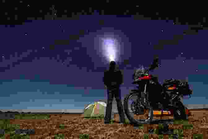 A Motorcycle Rider Camping Under A Starry Sky, Surrounded By The Tranquility Of Nature It S All About The Bike: The Pursuit Of Happiness On Two Wheels